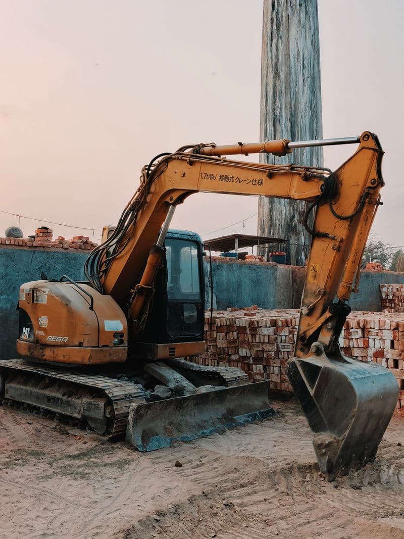 Yellow excavator at a construction job site on the Oregon Coast
