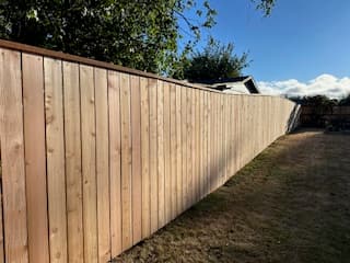 Wood fence installation on a residential property in Lincoln County