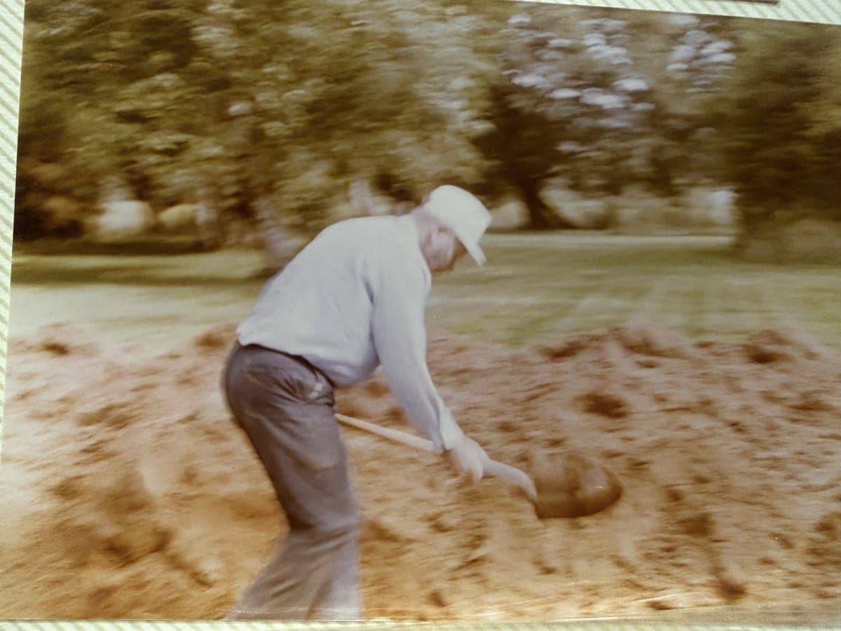 Great-grandfather shoveling on the job — four generations of builders